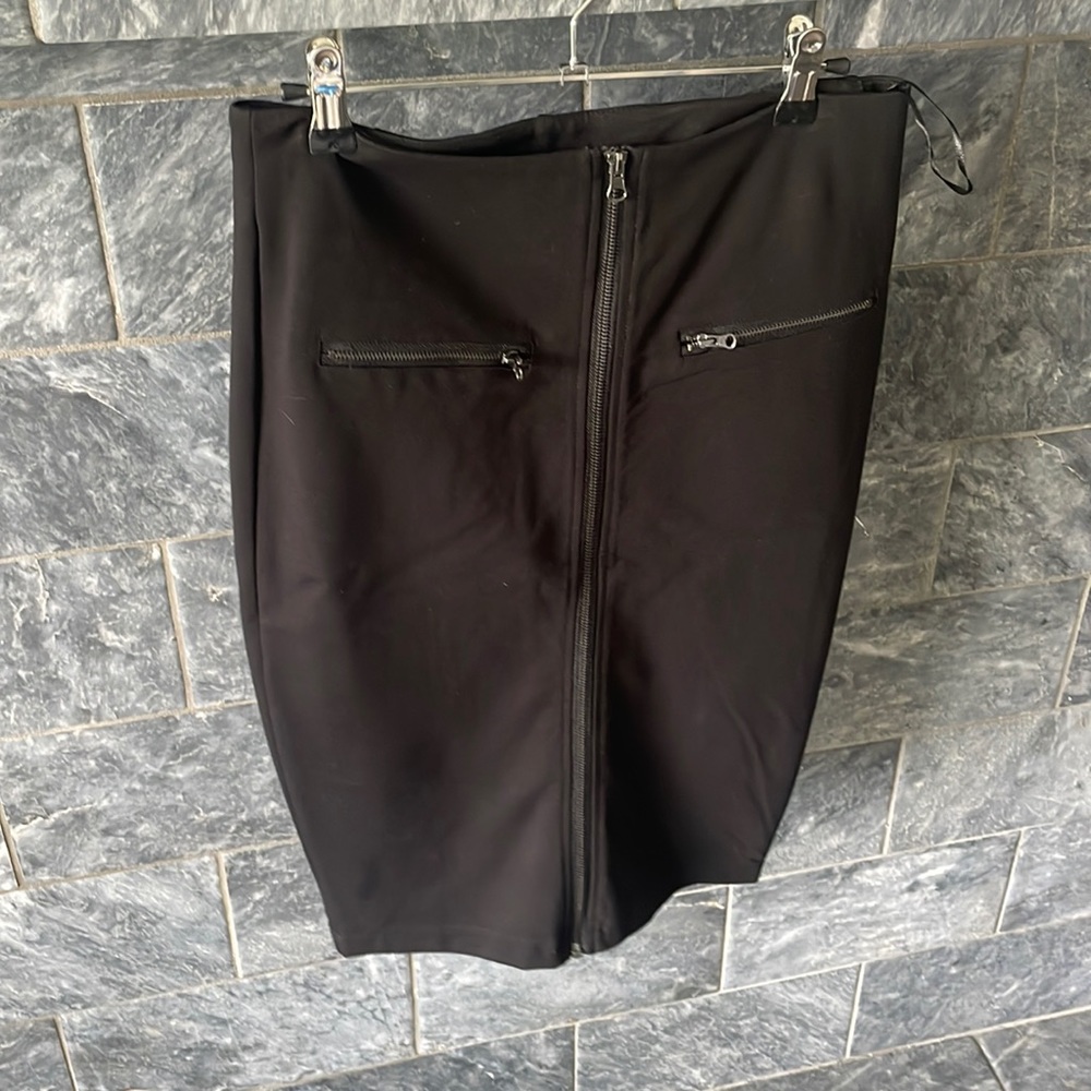 Black pencil skirt with zipper detail.
